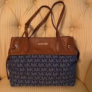 Micheal Kors canvas& leather purse. 14 inches across 12 inches high.